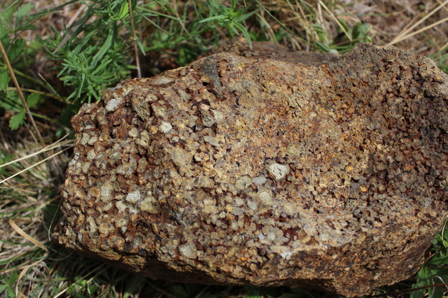 Tertiary rhyolite crystal lithic tuff host rock.